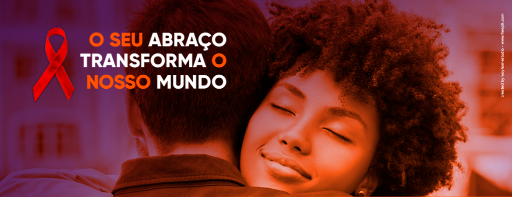 Campanha da ONG gestos. Duas pessoas se abraçam, com o texto "o seu abraço transforma o nosso mundo"